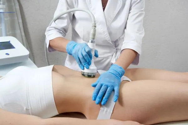 Lost the Weight but Not the Loose Skin? 2 woman having HIFU treatment on her stomach to combat loose skin Daventry following weight loss
